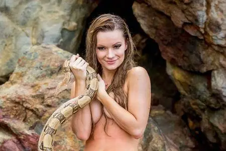 Caitlin O’Connor with a snake at the beach in Malibu on March 20, 2017