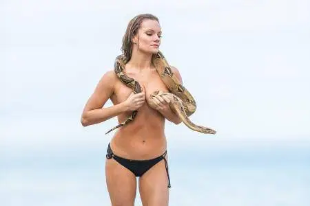 Caitlin O’Connor with a snake at the beach in Malibu on March 20, 2017