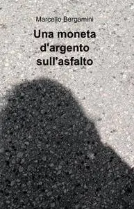 Una moneta d’argento sull’asfalto