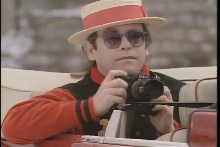 Elton john love me