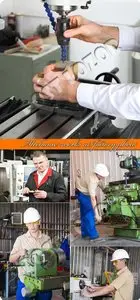 Mechanic works at factory photo