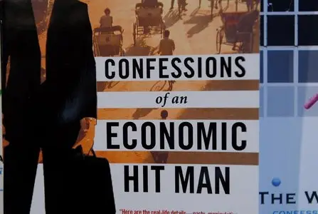 "Confessions of an Economic Hit Man" by John Perkins - Audiobook & Text