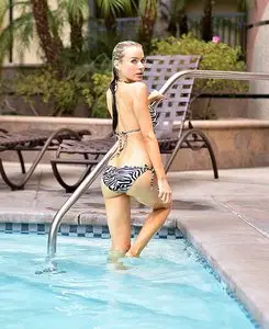 Paula LaBaredas - Bikini malfunction while taking a swim at her hotel’s pool August 29, 2012