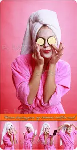 Woman dressing gown eye treatment and face mask