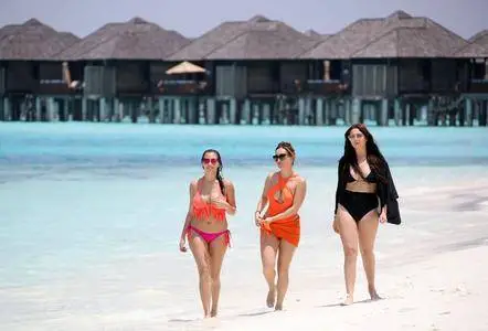 Sisters Amelia, Lauryn and Chloe Goodman at the beach in Maldives on March 28, 2017