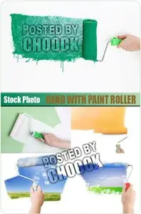 Hand with paint roller - Stock Photo