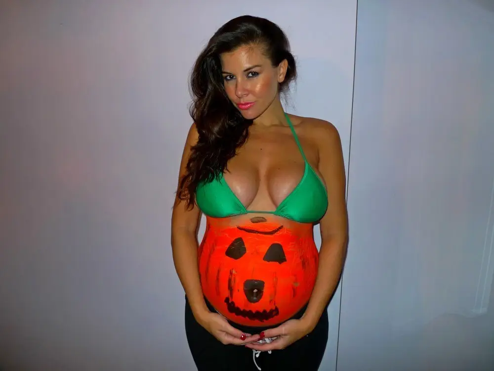 Imogen Thomas posing with her bumpkin in London October 24, 2012