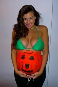 Imogen Thomas posing with her bumpkin in London October 24, 2012