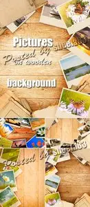 Stock Photo - Pictures on Wooden Background
