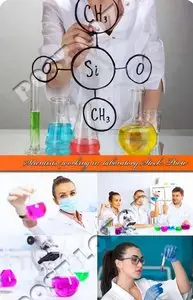 Scientists working in laboratory Stock Photo