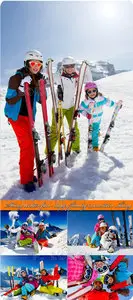 Skiing, winter fun - happy family mountain skiing 