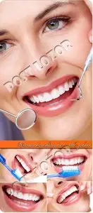 Woman brushing her teeth photo