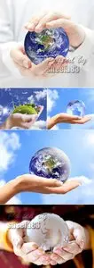 Stock Photo - Planet Earth on Human Hands