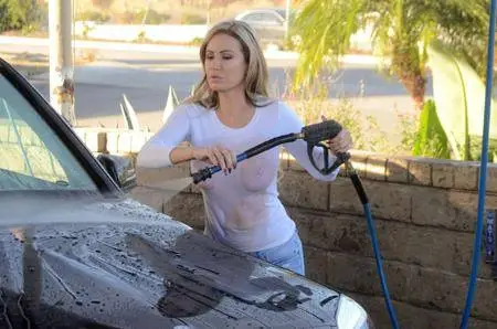 Ana Braga washing her Mercedes in Calabasas, CA on March 18, 2018