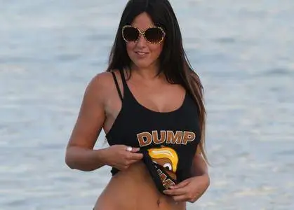 Claudia Romani wearing a Dump Trump t-shirt at Miami Beach on October 9, 2016