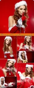 Christmas girl in red blowing snow photo