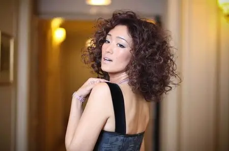 Gong Li poses for Louis Vuitton at Plaza Athene Hotel Paris September 13, 2010