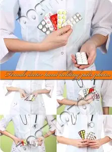 Female doctor hand holding pills photos