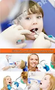 Dentist at work on woman patient photo